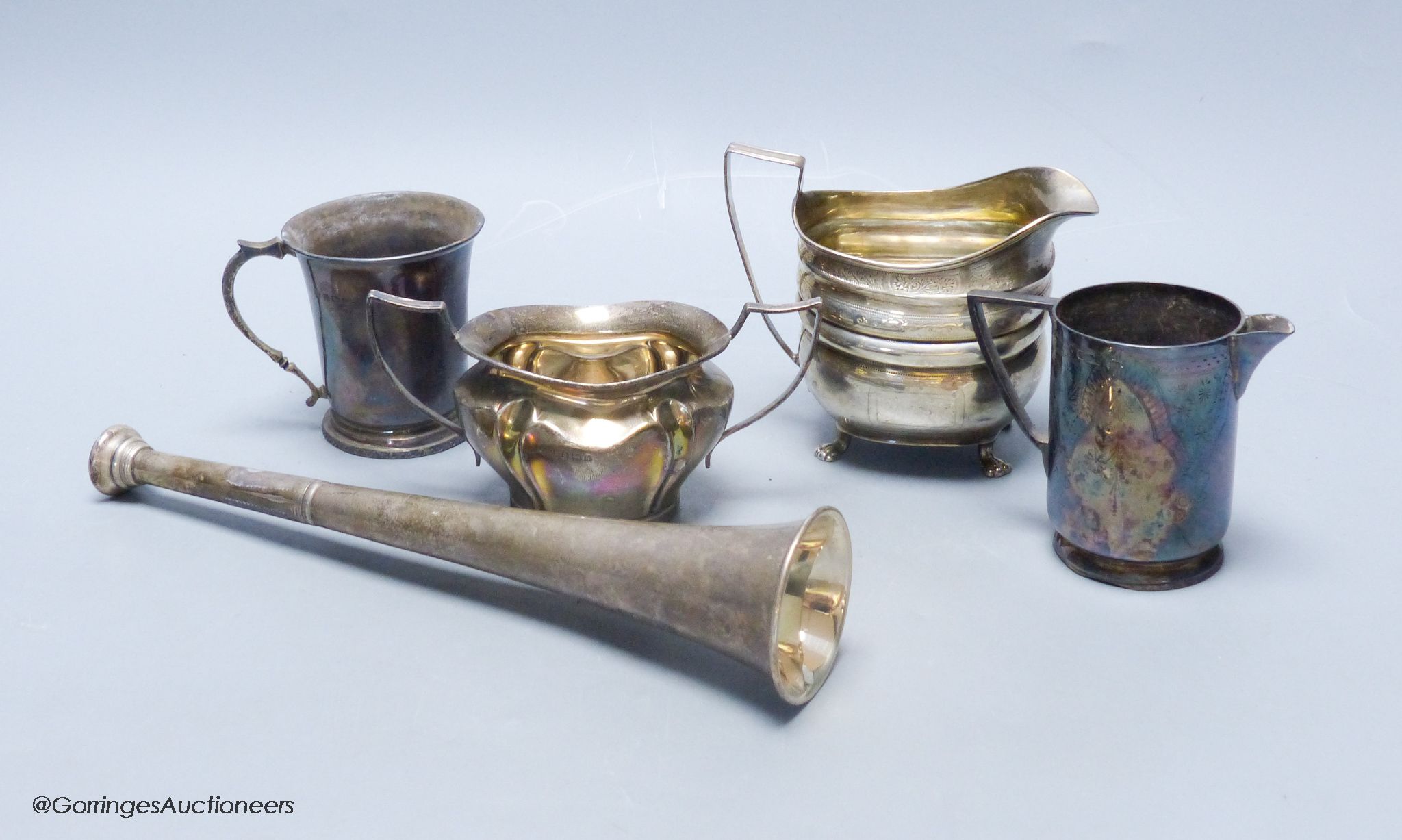 A Victorian silver hunting horn, London 1898, Sampson Mordan & Co, a Georgian bright-engraved silver oval cream jug and three other items, 18.05oz